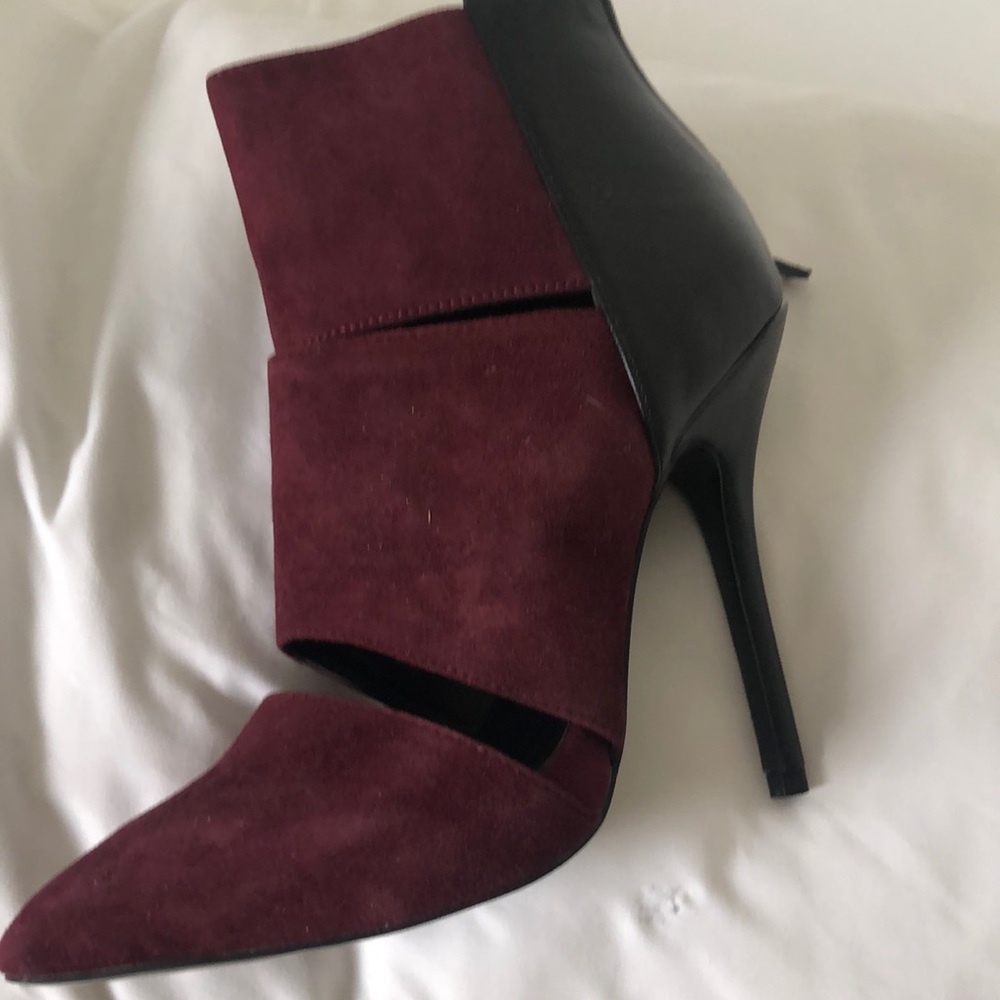 Burgundy Booties by Steve Madden. Black leather on the back.